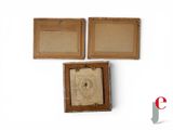 three pieces of cardboard with a picture of a man and a woman in a box