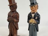two figurines of a man and a woman in top hats