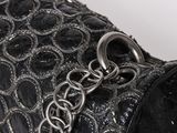 an image of a black purse with a chain on it