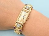 an image of a woman ' s wrist with a watch on it
