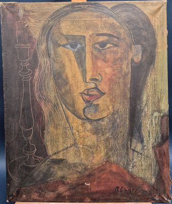 une peinture représentant le visage d'une femme sur un morceau de bois