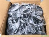 a cardboard box filled with a bunch of black and white items