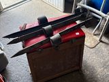 a box with a bunch of knives on top of it