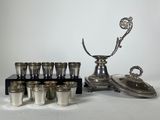 an image of a silver plated set of cups and a silver vase