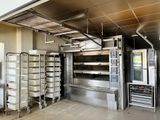 a commercial kitchen with a lot of food in it