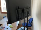 a television that is on a stand in a room