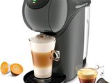une image d'une machine à café avec une tasse de café à côté d'elle