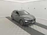the grey car is parked in the garage on the checkered floor