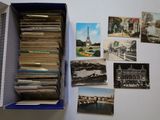 a box full of old postcards sitting on a table