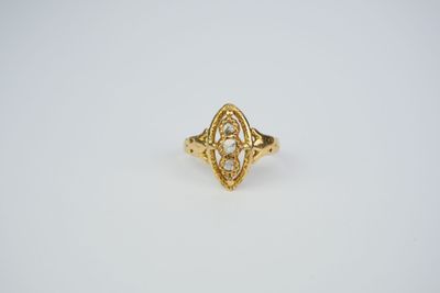 an image of a gold ring with a diamond in the center