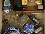 a box full of blue and white dishes and cups