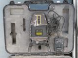 an open case with a laser level in it