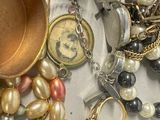 many different types of jewelry on the table