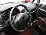 dashboard of a car with a steering wheel and dashboard controls