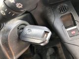 a close up of a car ' s dashboard with a car key in it
