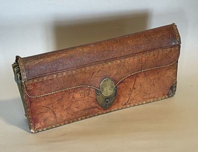 a brown leather case with a metal clasp on it