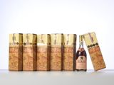 a close up of a bottle of liquor next to a row of lighters