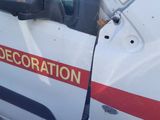 a white van with a red stripe on the side of it that has been vandalized