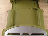 a green toaster sitting on top of a wooden table