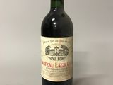 a bottle of wine that is sitting on a table
