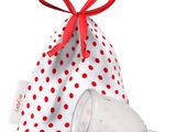 a white bag with red polka dots and a red ribbon
