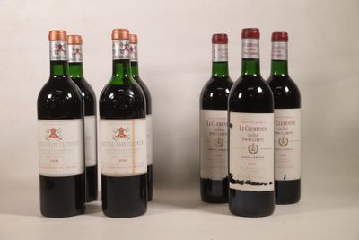 trois bouteilles de vin rouge sont alignées sur une table