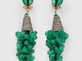 a pair of emerald and diamond earrings