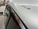 a close up of a car ' s hood with a sticker on it