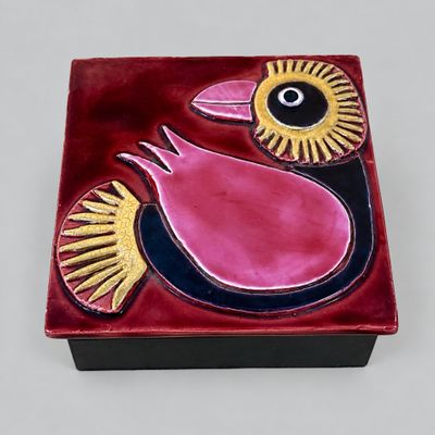 a red box with a bird design on it