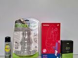 a bottle of liquid, a bottle of spray, and a box of toothpaste