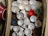many cups and bowls in a box with a price tag