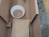a box with a cup and a bag of food inside of it