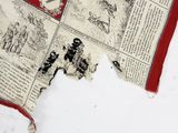 a piece of fabric that has been torn off of it
