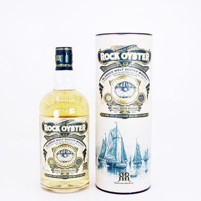an image of a bottle of rock oyster next to a canister
