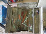 a box with tools in it sitting on the floor