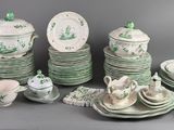 a lot of green and white dishes and plates