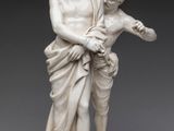 l'image d'une statue d'un homme tenant un enfant dans ses bras