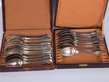 six spoons in a case that are sitting on a table