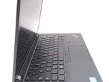a close up of a laptop on a white surface