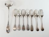 a lot of silver spoons and forks on the table