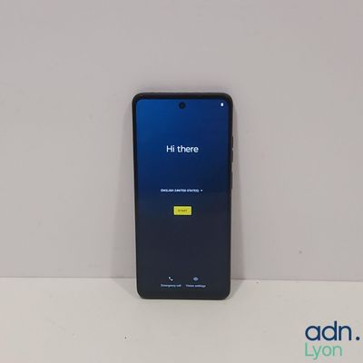 the back of a black samsung galaxy s9 with a blue screen and a yellow button