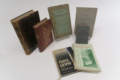 five books that are sitting on a white table