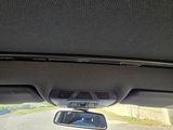 a view of a car ' s dashboard from inside the car