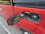 a close up of a car door handle with a sticker on it