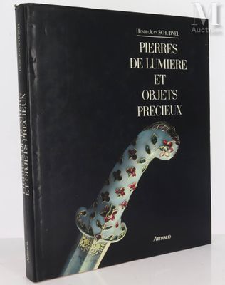the cover of a book with a dagger on it