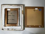 an old picture frame with a message on it next to an empty picture frame