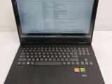 the laptop is open on a white surface with a keyboard