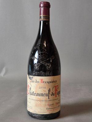 a bottle of wine that is sitting on a table
