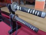 two samurai swords that are on display in a room