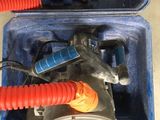 a blue box with a red hose and a blue box with a red hose